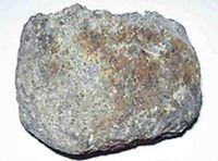 Ett litet foto av den magmatiska bergarten peridotit