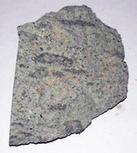 Ett litet foto av den magmatiska bergarten Ignimbrit.