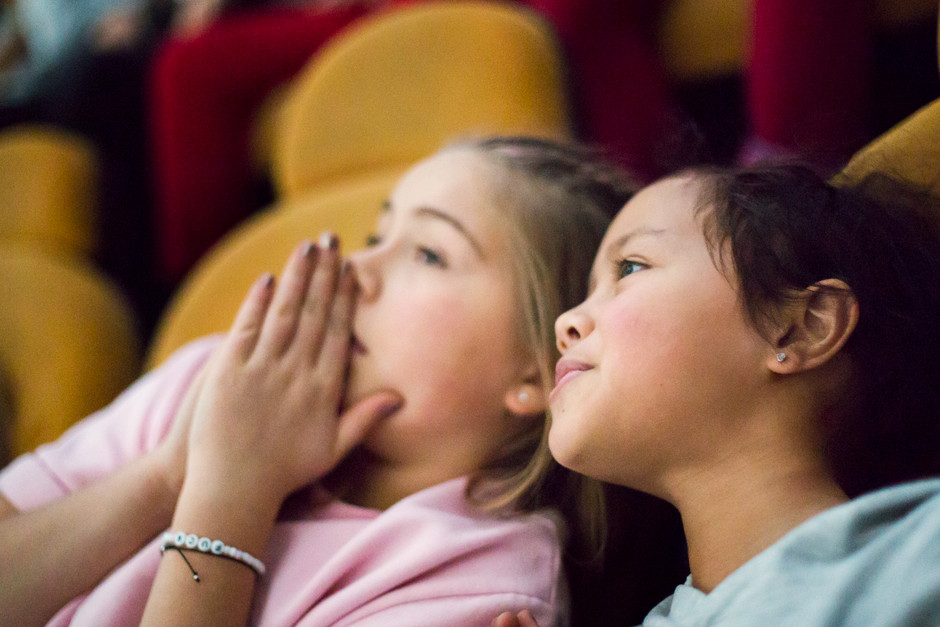 Two children in a cinema.